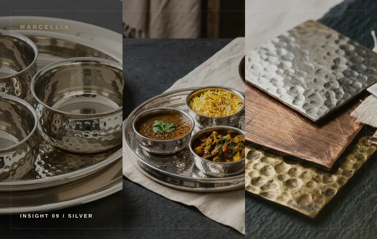 Silver-tone metal tableware and serveware arranged for buyer review